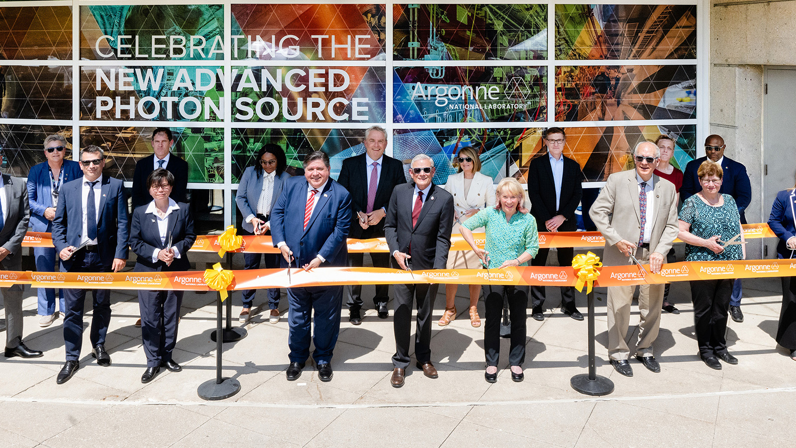 People cutting a ribbon.